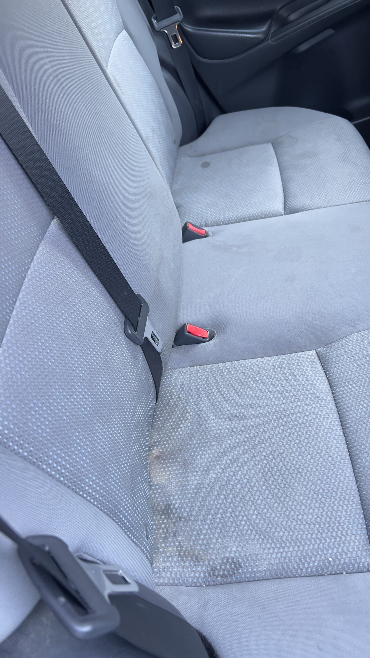 back seat before steam cleaning – car detailing Ottawa